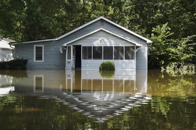 At least 6 people have died from days of storms and record-setting flooding in Indiana