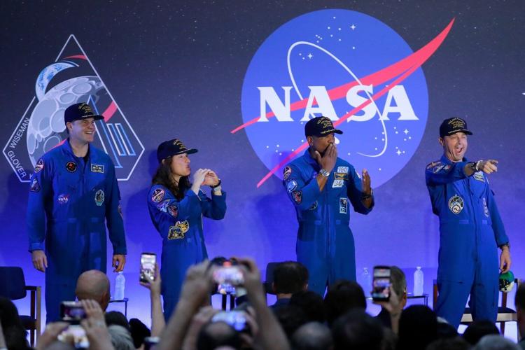 Artemis II's moon-traveling astronauts return home to cheers after a record-breaking trip