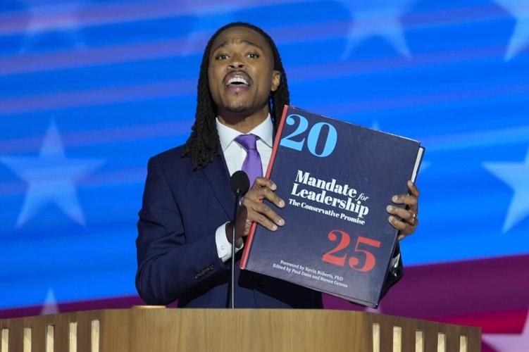 Throwing the book: Democrats enlarge a copy of the 'Project 2025' blueprint as an anti-GOP prop