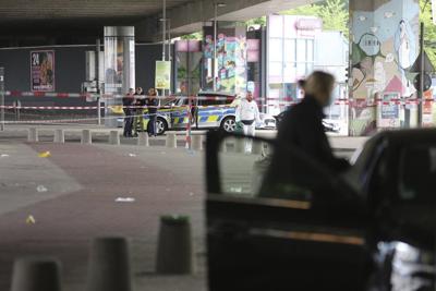 German police search for man who attacked and injured several people outside a bar