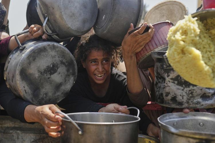 Baby girl killed with parents in Gaza airstrike as Israelis urge a mass protest over the war