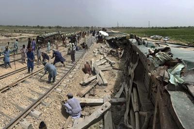 Rail service in southern Pakistan is partially restored after train crash that killed 30 people
