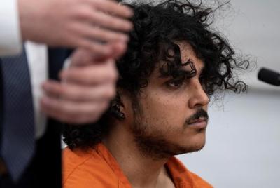 Suspect in New York hotel killing remains in custody without bond in Arizona stabbings