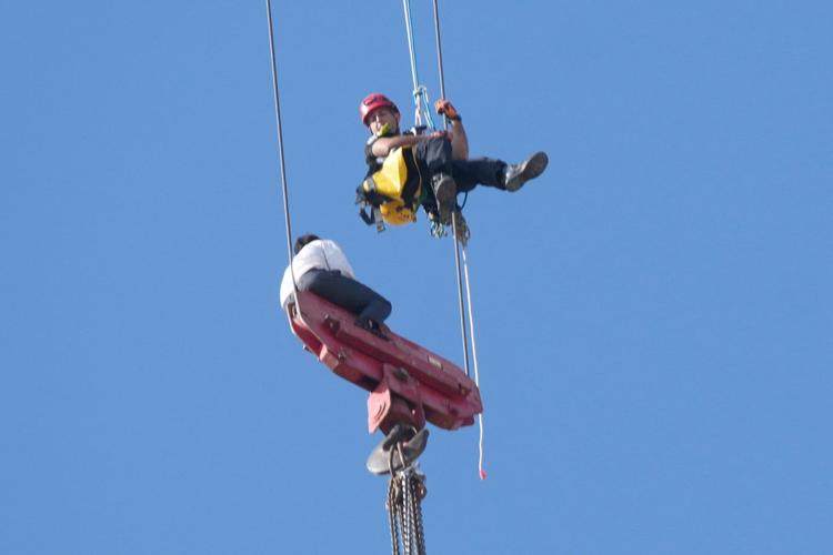 Fire teams rescue 15-year-old stuck on crane over high-rise building in Jerusalem