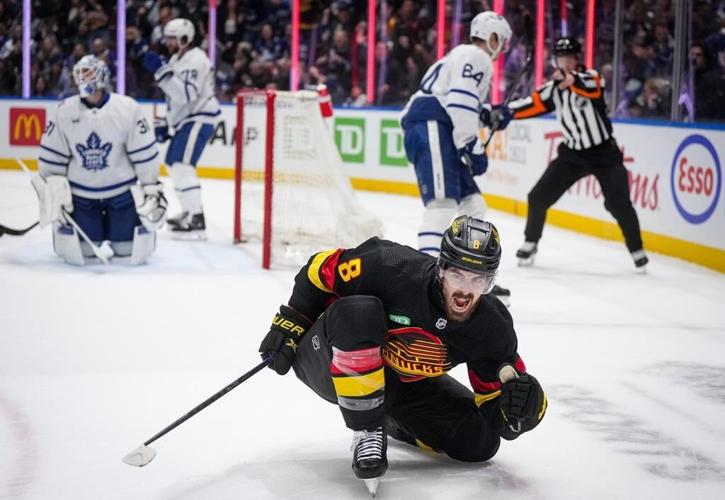 Late power-play goals lead Canucks past Leafs 6-4