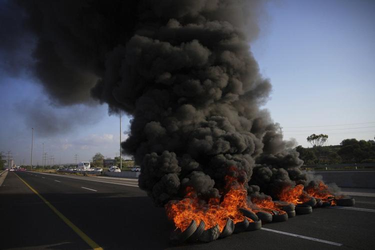 Photos of Israelis demanding the release of hostages and an end to the war with Hamas