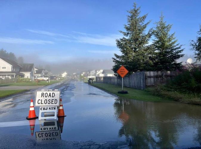 New river barriers prevented severe flood damage from a glacial outburst in Alaska, officials say