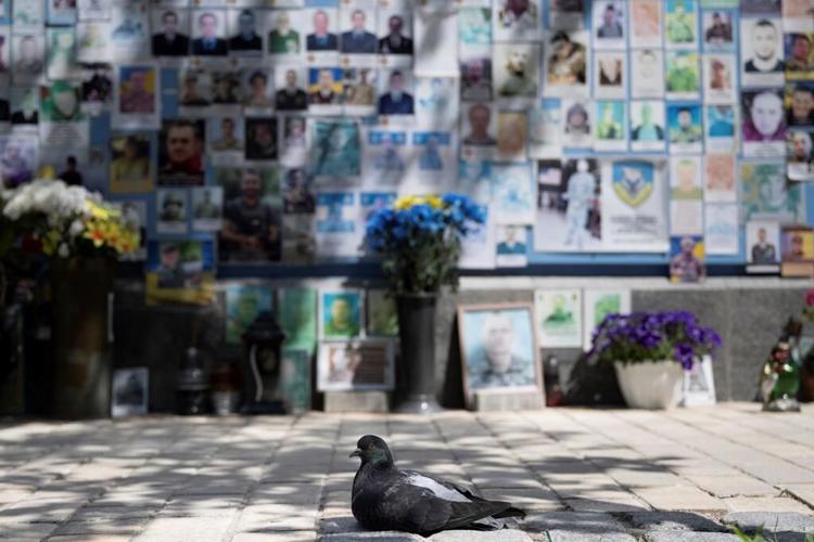 Ukrainian troops pull out of some areas and Zelenskyy postpones foreign trips amid Russian offensive