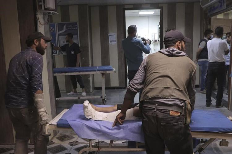 Drone attack kills 80 and wounds 240 at a packed Syrian military graduation ceremony, official says