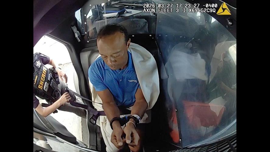 Bodycam shows a stunned Tiger Woods handcuffed after a Florida rollover crash