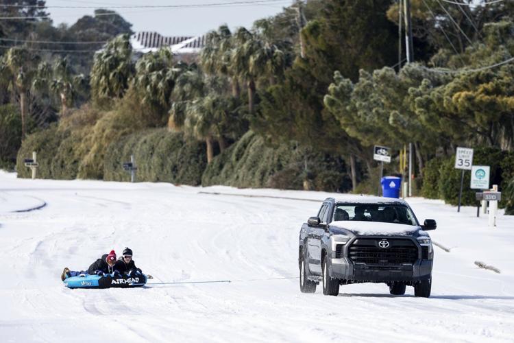 Winter storm spreads across the Deep South, creating icy danger and snowy fun