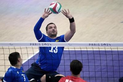 A Ukrainian Paralympian left the warfront to compete in Paris. His mind is on his platoon in 'hell'