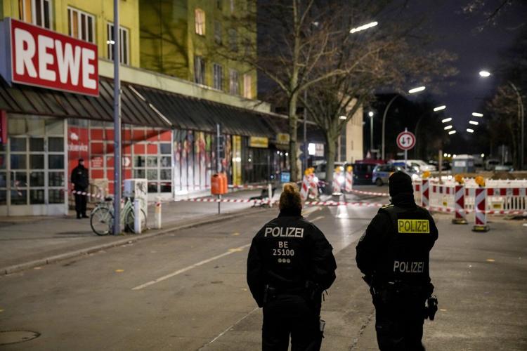 Berlin police say they have detained a man who attacked 2 people with a knife
