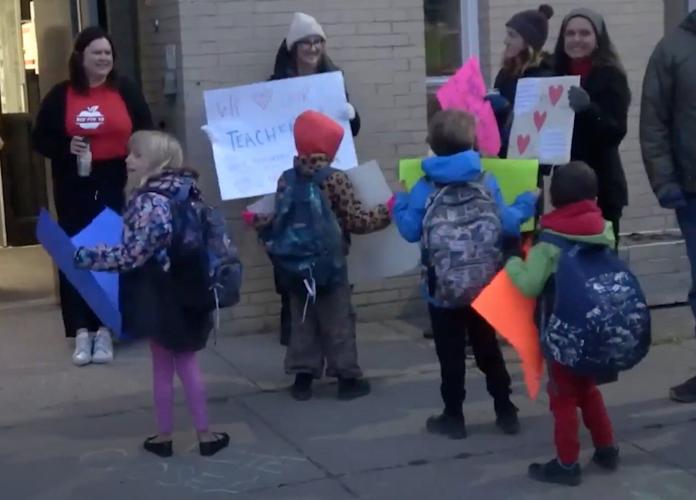 Red shirts and red-rimmed eyes: 740,000 Alberta students back to classes post-strike