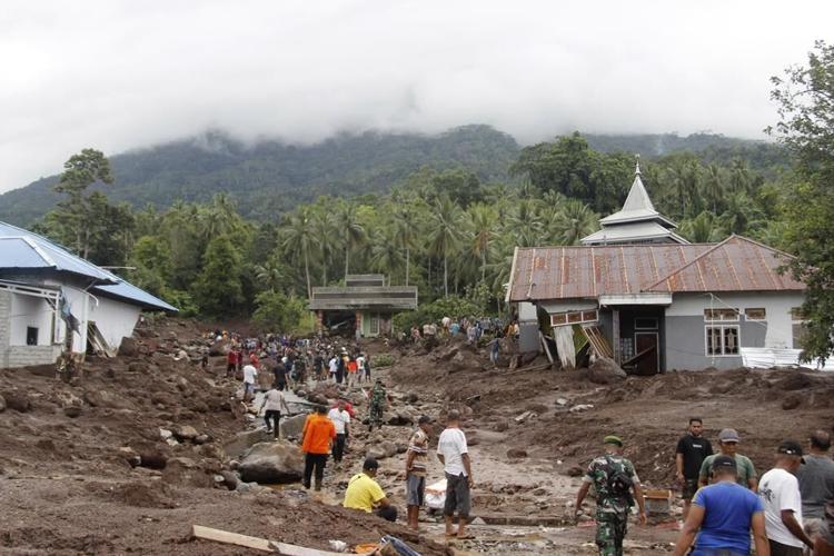 A flash flood on Indonesia's eastern Ternate Island sweeps away buildings and leaves 13 dead