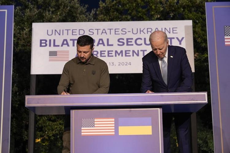 Biden and Zelenskyy sign security deal as Ukraine's leader questions how long the unity will last
