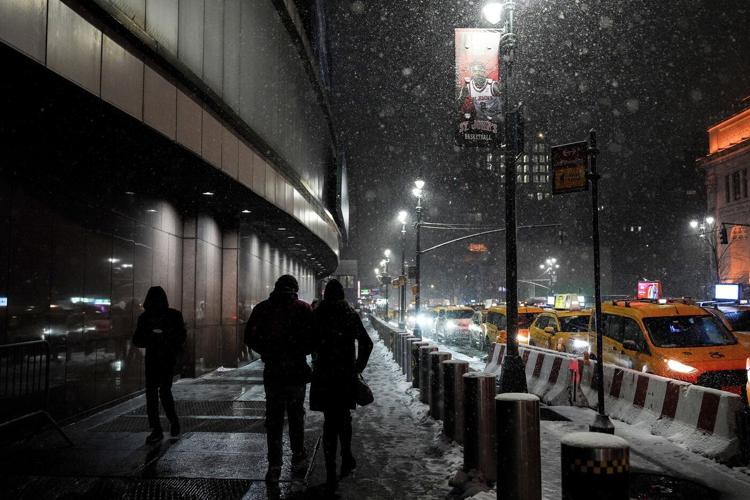 Snow and freezing rain cause crashes in Virginia while California prepares for likely flooding