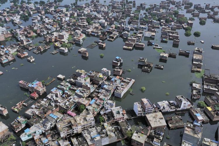 Flash floods kill at least 4 and trap others under debris in northern India