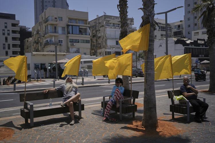 Israeli airstrikes kill 14 Palestinians in Gaza and another 10 die seeking food