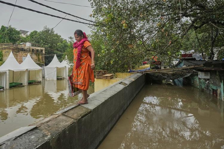 Photos show how one New Delhi family is coping after being displaced twice by floods
