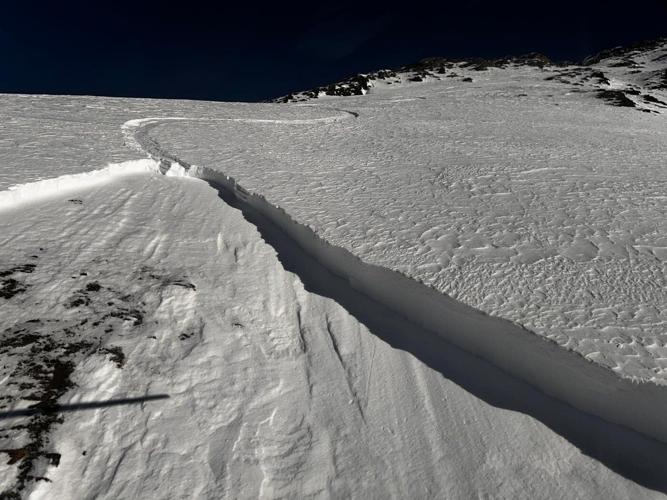 Skier buried up to waist after triggering backcountry avalanche in Alberta Rockies