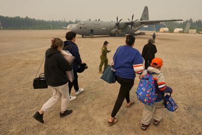 Governments to give financial aid to wildfire evacuees in Manitoba and Saskatchewan