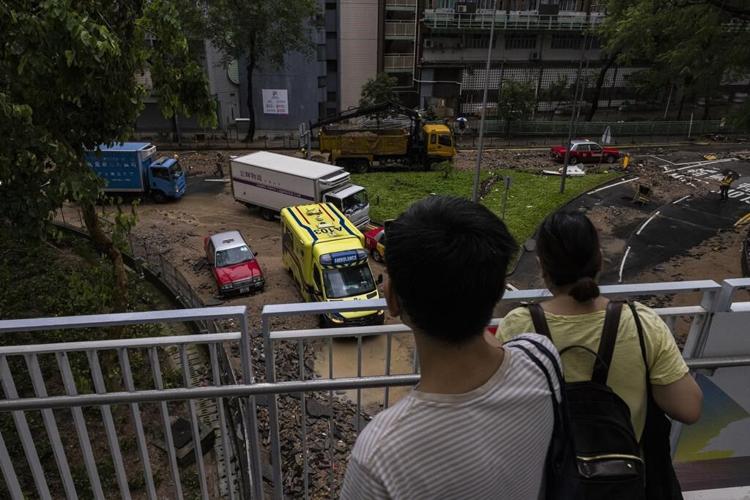 Rain pouring onto Hong Kong and southern China floods city streets and subway stations