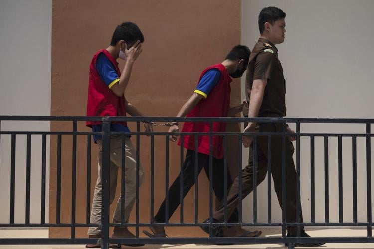 Shariah court in Indonesia sentences 2 men to up to 85 lashes for having gay sex