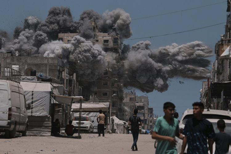 AP PHOTOS: An AP photographer captures the moment an Israeli airstrike slammed into Gaza City