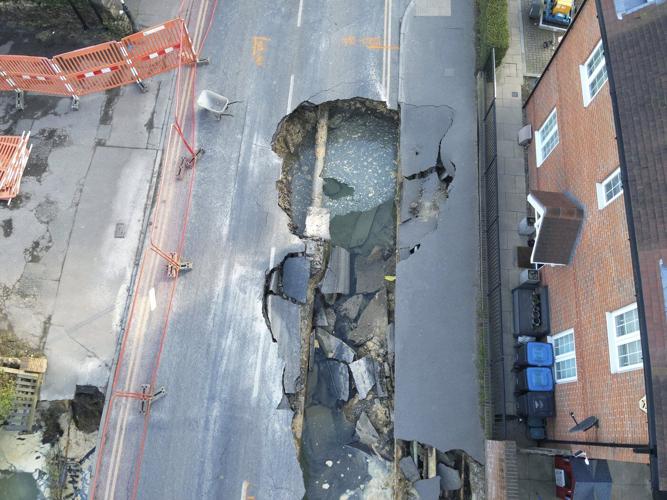 Sinkhole opens up on the main street of an English village