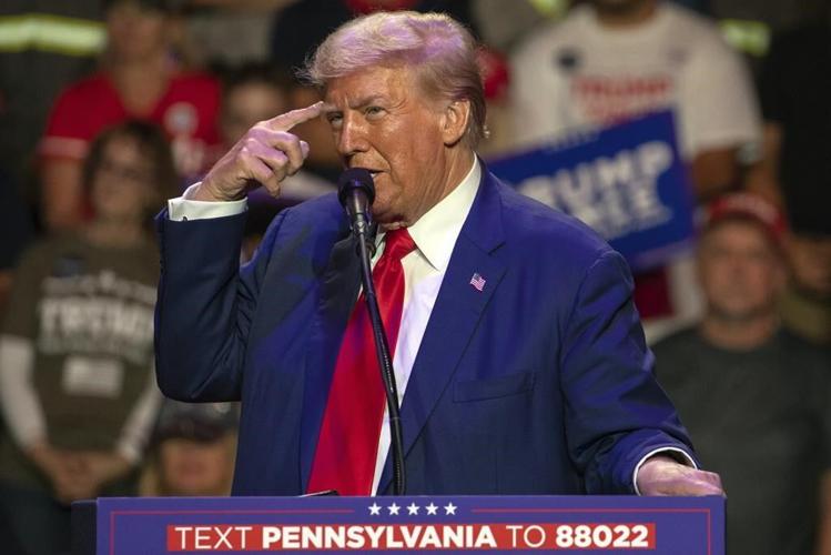 Trump listens during a farming event in rural Pennsylvania, then threatens John Deere with tariffs