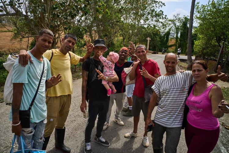 Photos of freed prisoners reuniting with families outside a Cuban prison