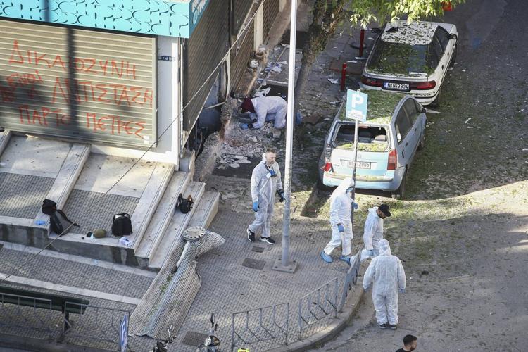 Woman dies when a bomb she is carrying explodes in the Greek city of Thessaloniki, police say