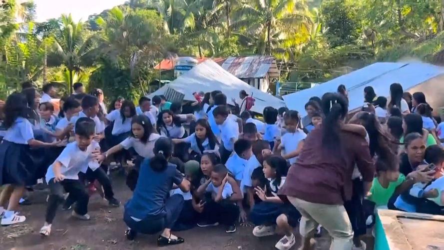 A 7.8 magnitude quake in the Philippines kills at least 16, fells buildings and sets off a tsunami