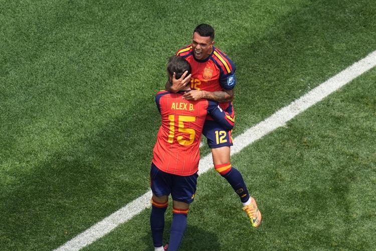 Mikel Oyarzabal's 2 goals send dominant Spain past Austria 3-0 and into round of 16 at the World Cup