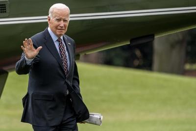 Biden signs bill to keep government open through Dec. 23