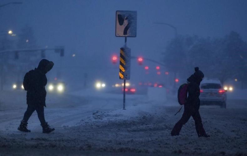 Snow, rain slam California as Michigan suffers without power