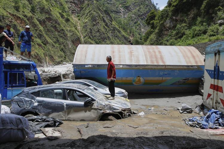 Rescuers search for 19 missing and recover 9 bodies after flooding in Nepal