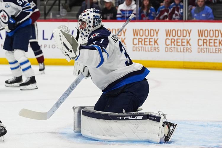 Perfetti's late goal helps Jets roll over Avalanche 4-2