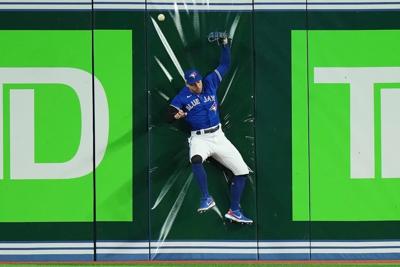 George Springer carted off field in Blue Jays' 10-9 wild card loss to Mariners