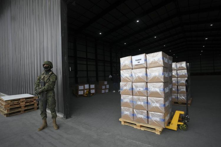 Polls open in Ecuador with conservative incumbent and leftist lawyer leading the presidential race