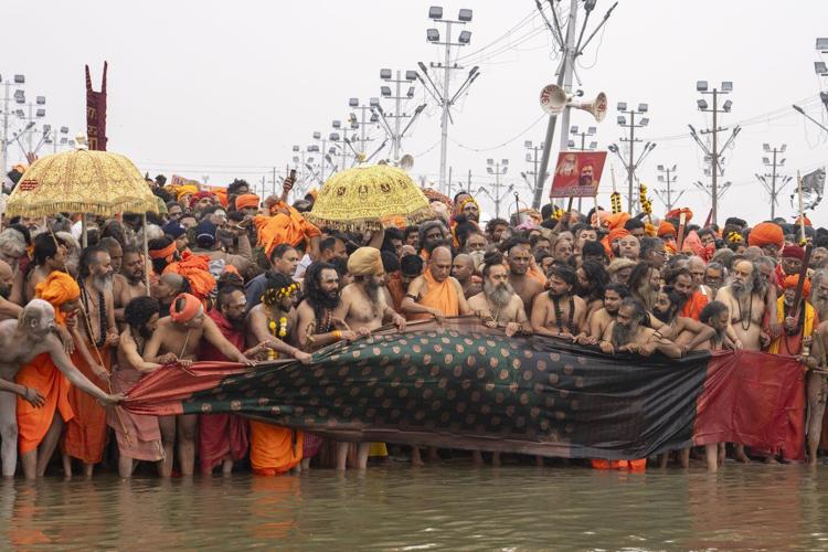 Millions of pilgrims and naked, ash-smeared ascetics take holy dips in India's mega Hindu festival