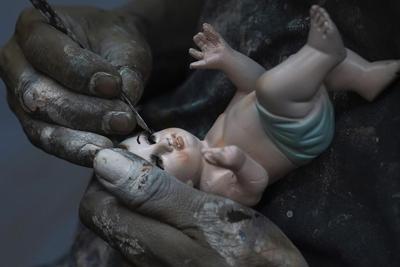 Broken baby Jesus statues flood restorers ahead of feast day