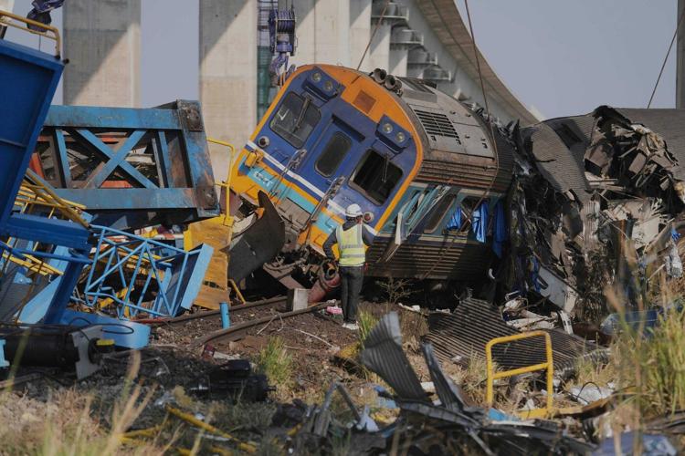 Photos show rescue workers at scene of crane collapse and train derailment in Thailand