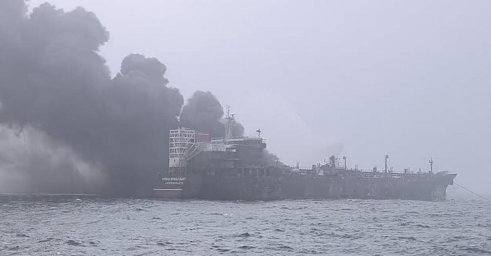 A cargo ship hits a tanker and they catch fire off England, with one crew member missing