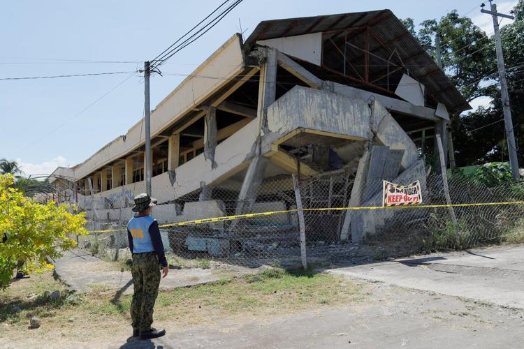A 7.8 magnitude quake in the Philippines kills at least 19, fells buildings and sets off a tsunami