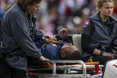 Michigan's Hart back from hospital after medical emergency