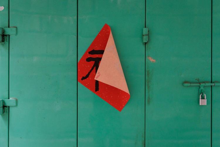 Photos follow the color red through public and intimate spaces during the Lunar New Year
