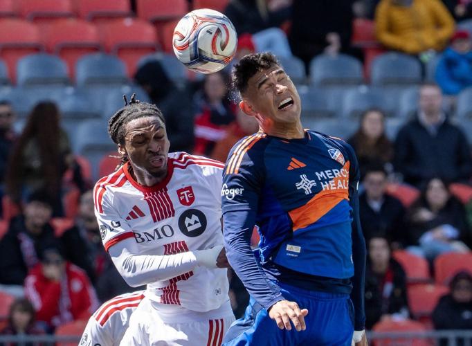 Short-handed Cincinnati score late to salvage 1-1 draw with Toronto FC