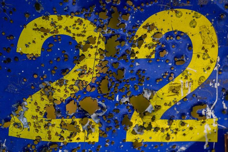 Photos show Ukraine's historic center in ruins but children, athletes still train ahead of Olympics